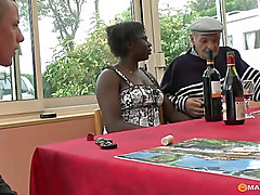 The girl drinks with two men